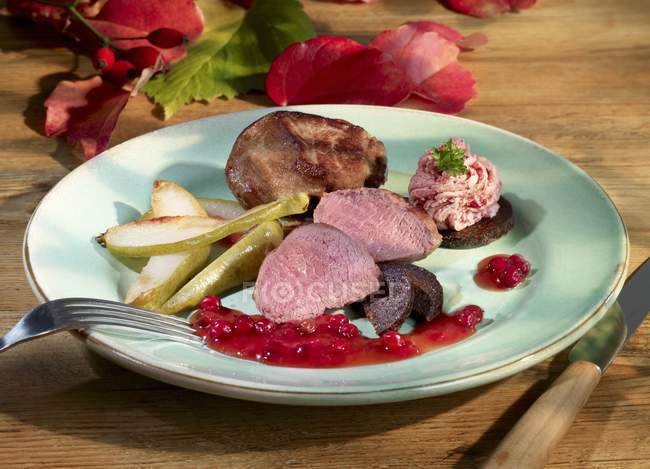 Venison fillet with pears — Stock Photo