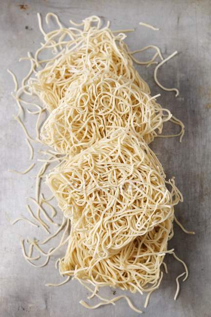 Dry uncooked Mie wheat pasta — Stock Photo