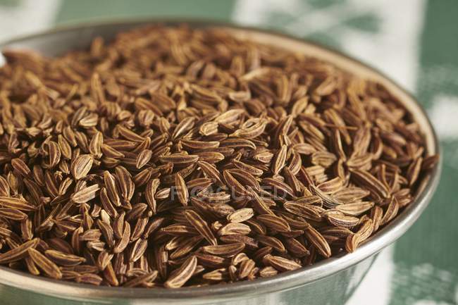 Caraway seeds in metal bowl — Stock Photo