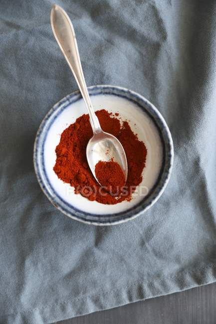 Paprika powder in bowl — Stock Photo