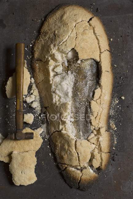 Top view of fish fried in a crust of salt — Stock Photo