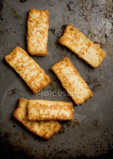 Fried halloumi scattered — Stock Photo