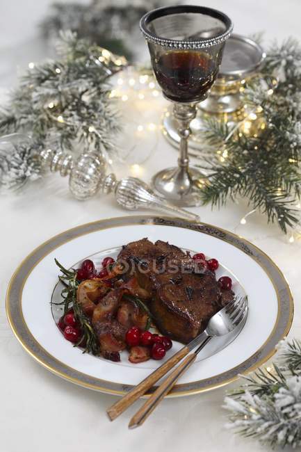 Beef steak with bacon and cranberries — Stock Photo