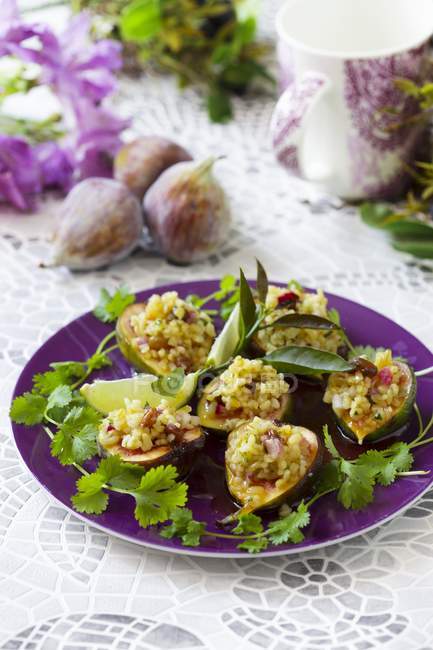 Closeup view of spicy stuffed figs and herbs — Stock Photo