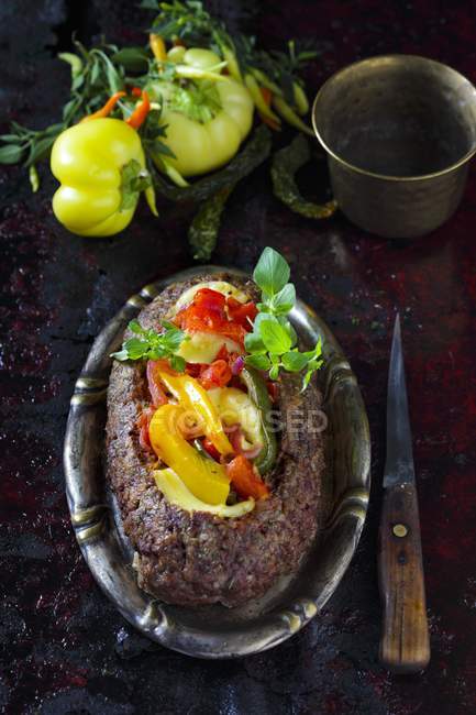 Meatloaf with cheese and peppers — Stock Photo