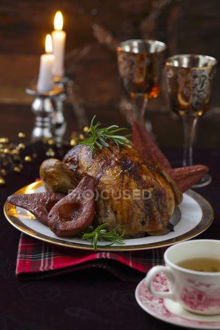 Closeup view of Capon with red wine pears and tea — Stock Photo
