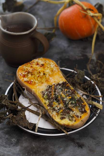 Closeup view of butternut squash filled with beef and millet — Stock Photo