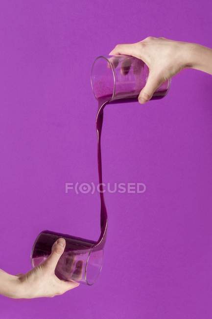Smoothie pouring from glass — Stock Photo
