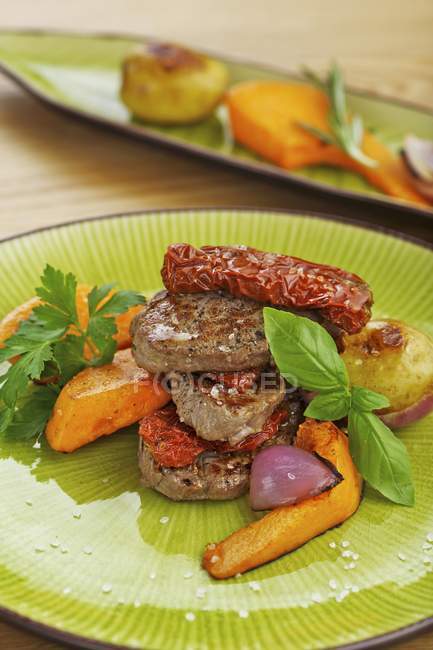 Beef fillet with tomatoes — Stock Photo
