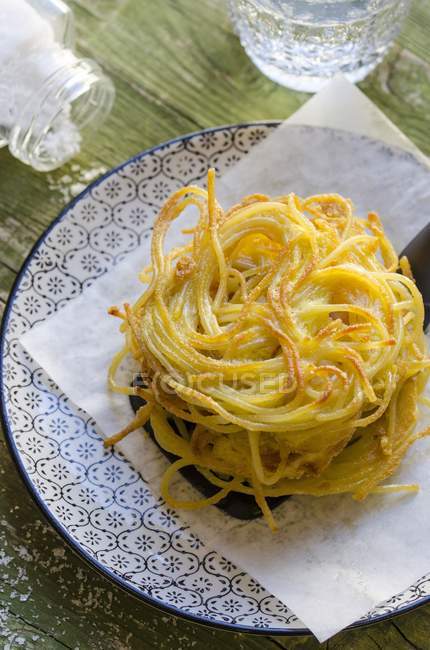 Baked Italian spaghetti pasta nest — Stock Photo