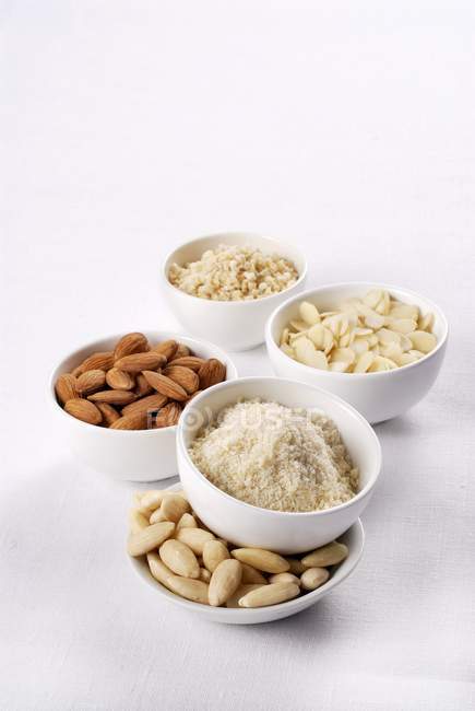 Almonds  in bowls over white — Stock Photo