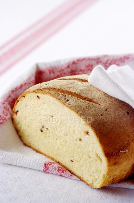 Kamut bread on towel — Stock Photo