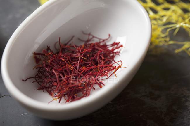 Bowl of saffron threads — Stock Photo