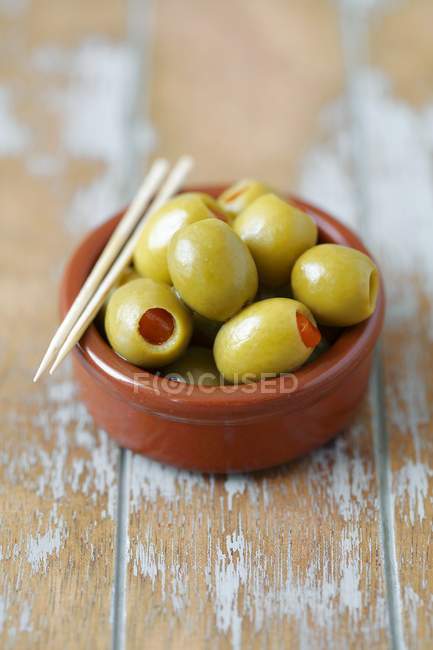 Green olives filled with peppers — Stock Photo