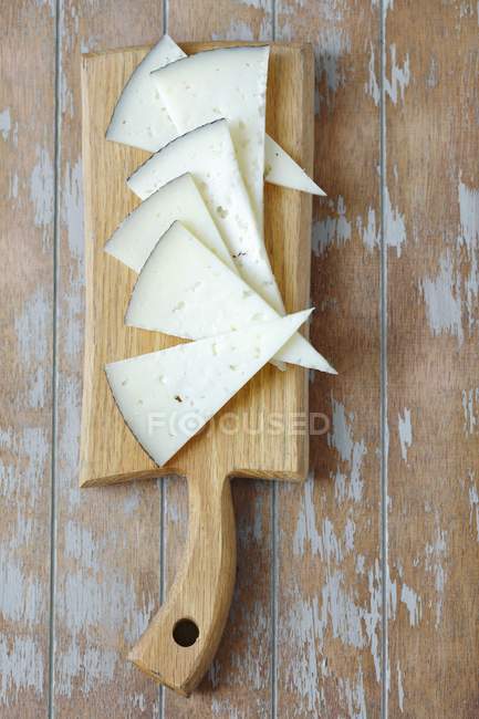 Triangles of Manchego cheese — Stock Photo