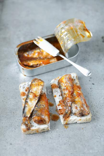 Toasts with sardines in tomato sauce — Stock Photo