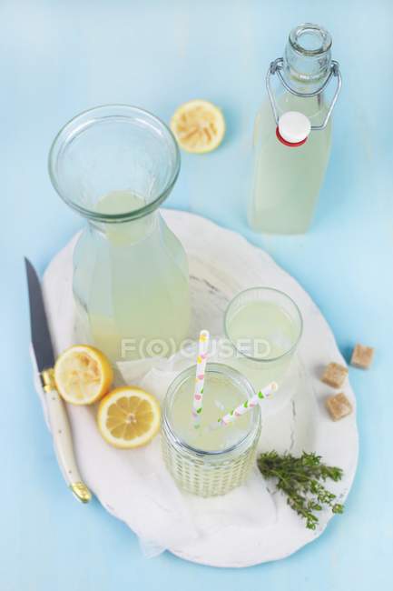 Thyme lemonade in bottle — Stock Photo