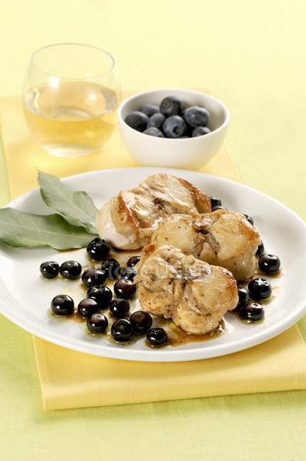 Rabbit with olives and blueberries — Stock Photo
