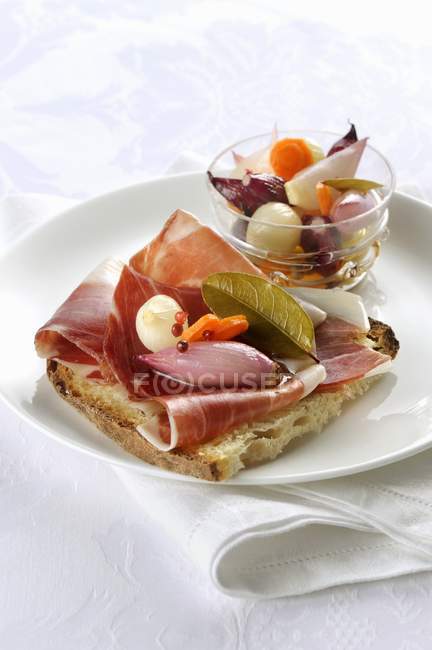 Grilled bread topped with ham — Stock Photo
