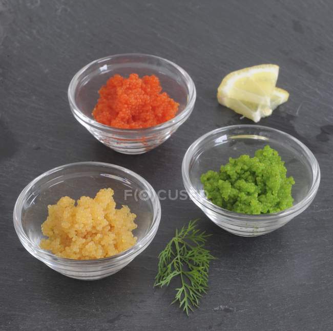 Closeup view of Tobiko fish roe in glass bowls — Stock Photo