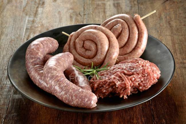 Minced beef and sausages — Stock Photo