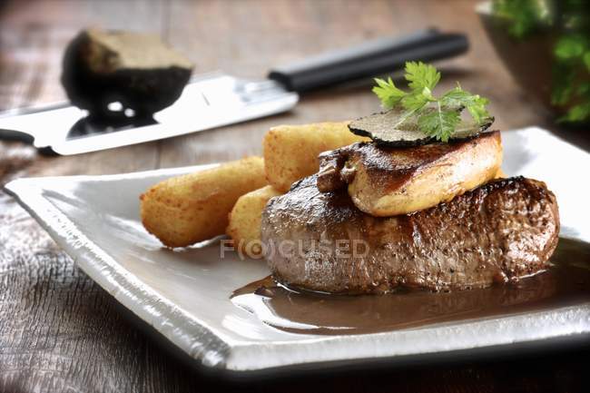 Beef steak with truffles — Stock Photo