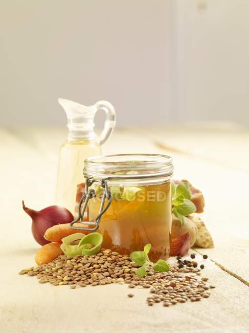 Ingredients for lentil soup on white surface — Stock Photo