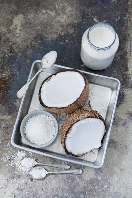 Top view of coconut fresh, dessicated and coconut oil — Stock Photo