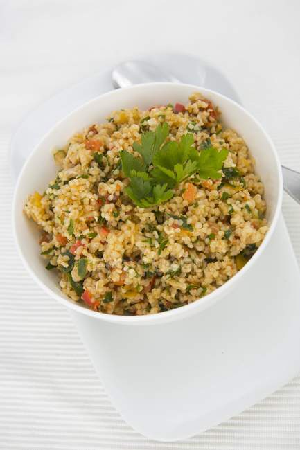 Bulgur salad with parsley in bowl — Stock Photo