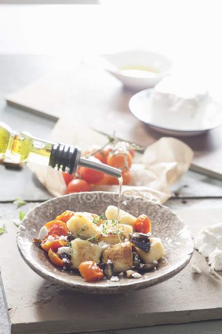 Fried gnocchi with aubergines — Stock Photo