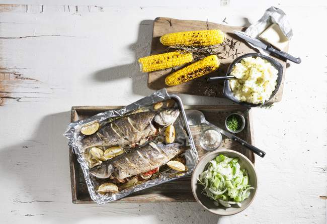 Oven roasted trout with corn — Stock Photo