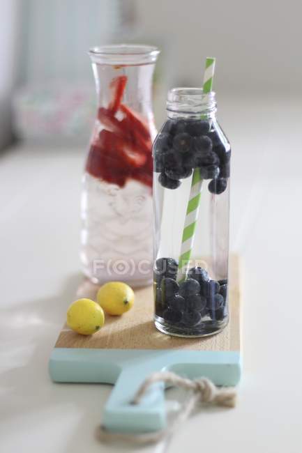Closeup view of infused water flavoured with fresh berries — Stock Photo