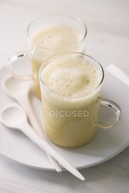 Almond milk and coconut oil — Stock Photo