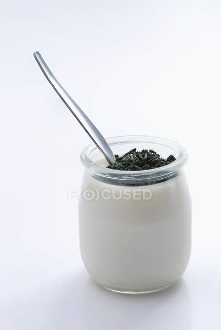 Yogurt with spirulina in glass jar — Stock Photo