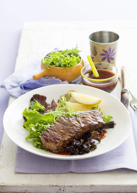 Beef steak with barbecue sauce — Stock Photo