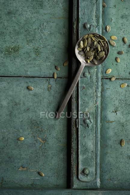 Pumpkin seeds on spoon — Stock Photo