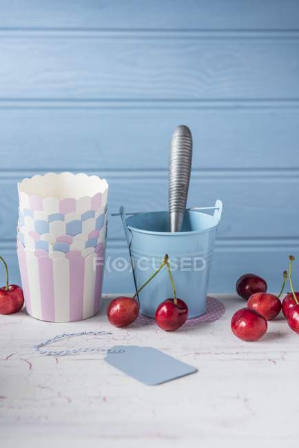 Cherries with paper cups — Stock Photo