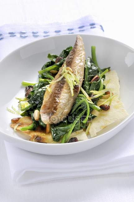 Mackerel with spinach on bread — Stock Photo