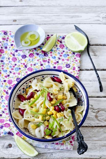 Cold farfalle pasta salad with corn — Stock Photo