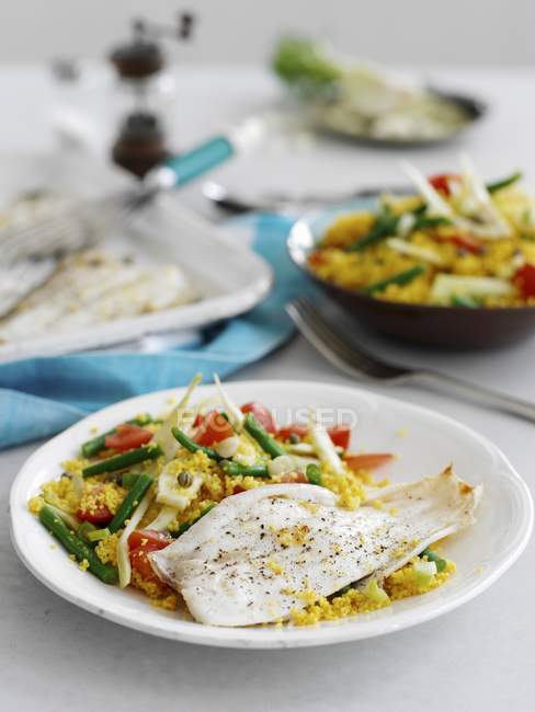Grilled lemon sole with golden couscous — Stock Photo