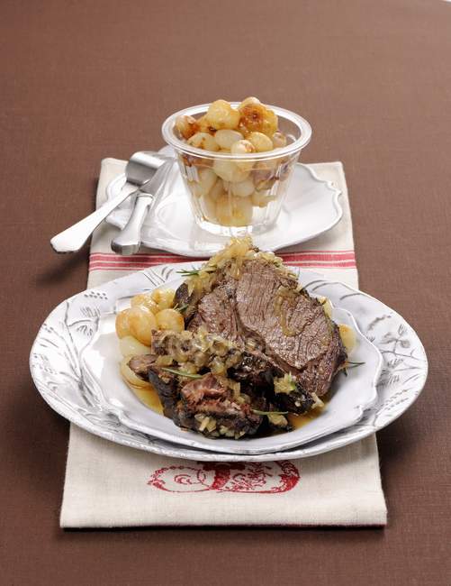 Roast beef with onions — Stock Photo