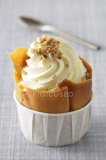 Closeup view of baked dish filled with cream and nuts — Stock Photo