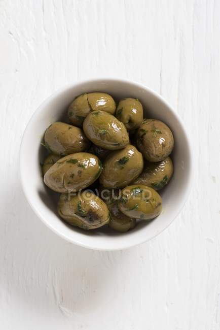 Green Paterno olives with parsley — Stock Photo