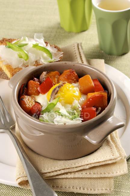 Cocotte with pepper in bowl — Stock Photo