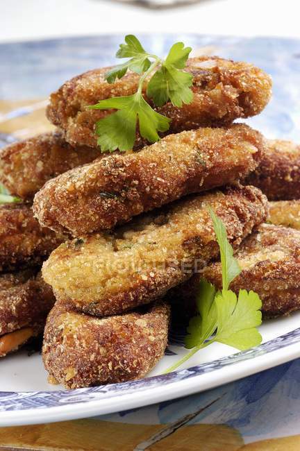 Aubergine fritters  on white plate — Stock Photo