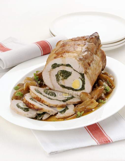 Pork roulade filled with herbs and eggs — Stock Photo