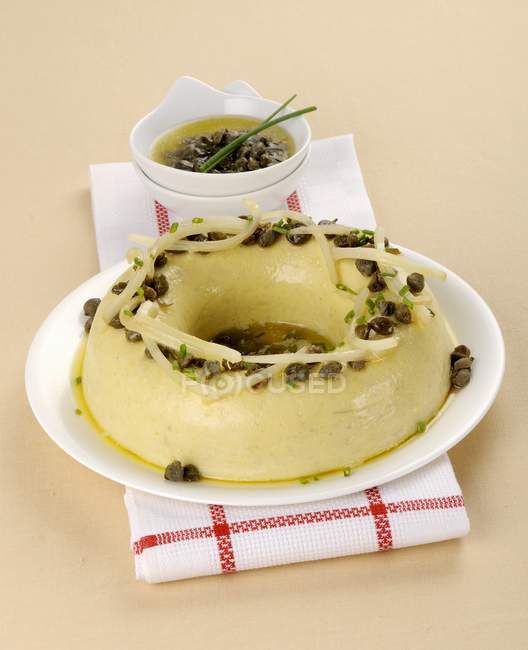 Cardi pudding with a caper sauce — Stock Photo