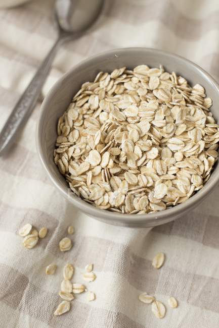 Closeup view of a gray bowl of oats — Stock Photo