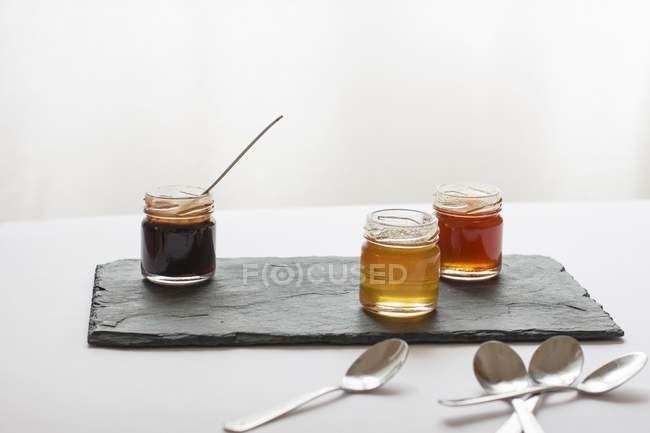 Various jars of honey — Stock Photo