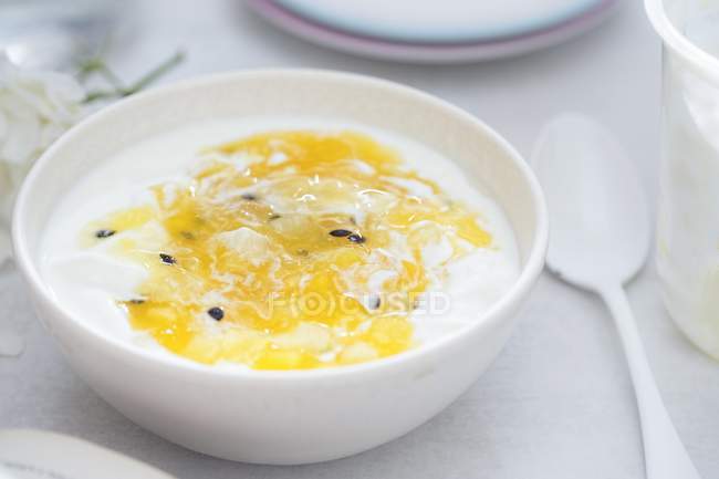 Yogurt with mango and passion fruit — Stock Photo